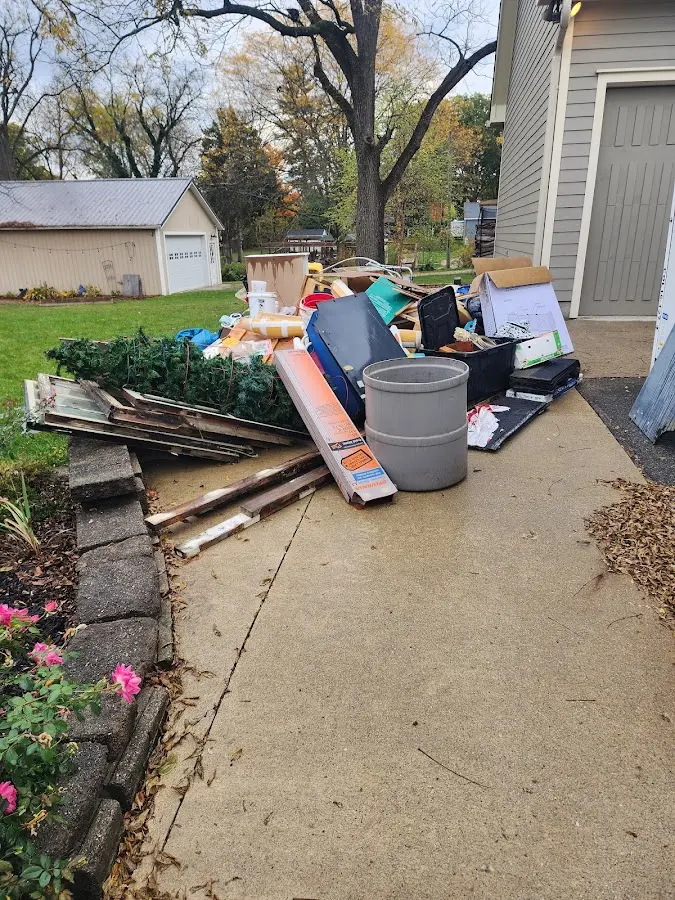 Dumpster being loaded with debris for Demolition Dumpster Rental in Waldron